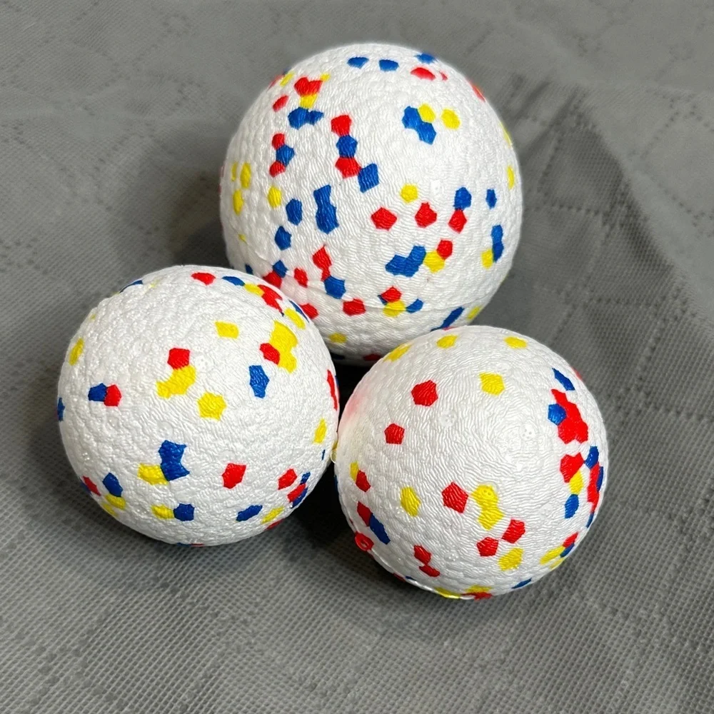 3 pack Vibrant Dog Play Balls with Red, Blue, and Yellow Accents 1 large 2 med
